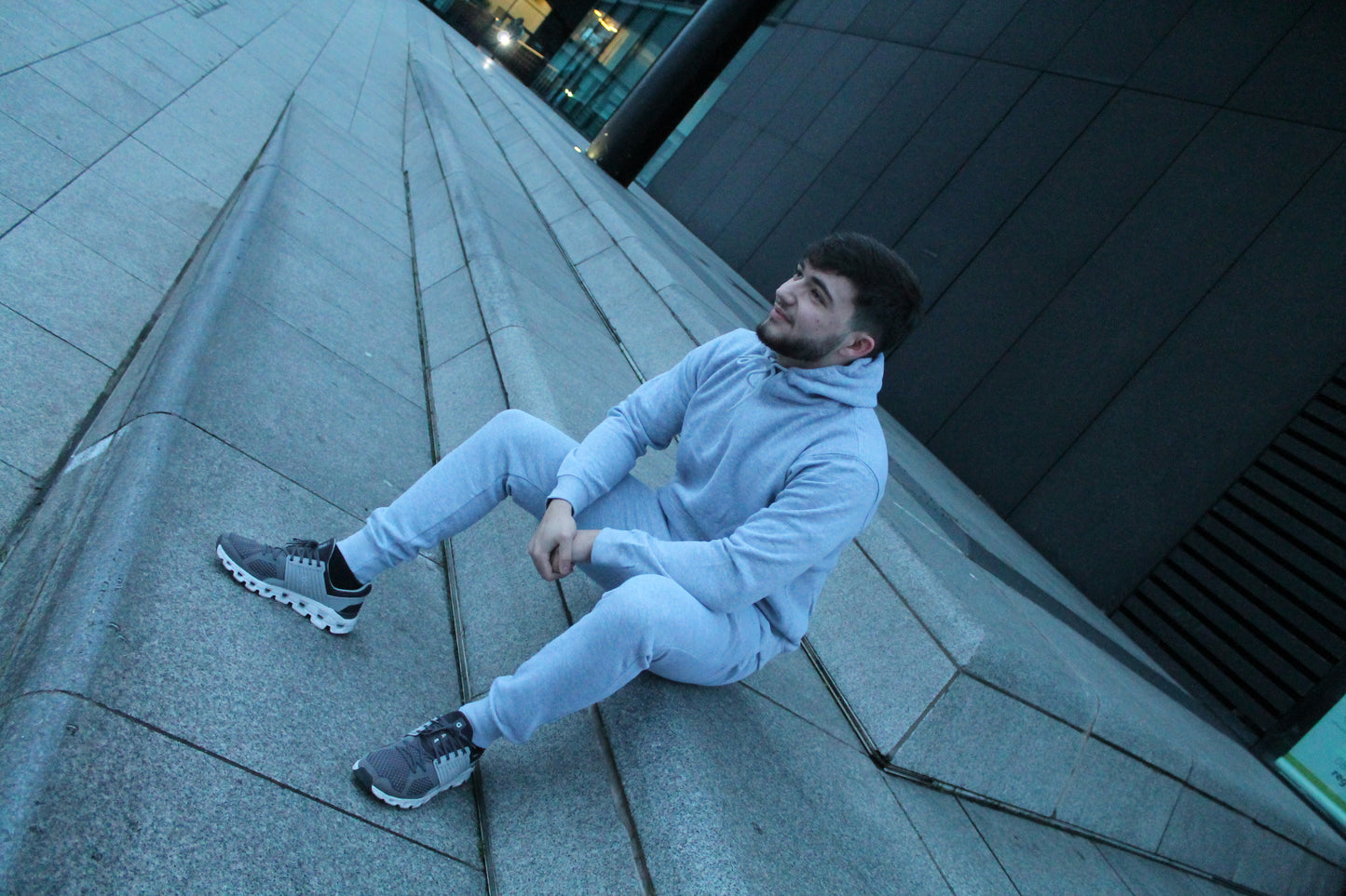 Men's Grey Tapered Plain Tracksuit Model On Stairs